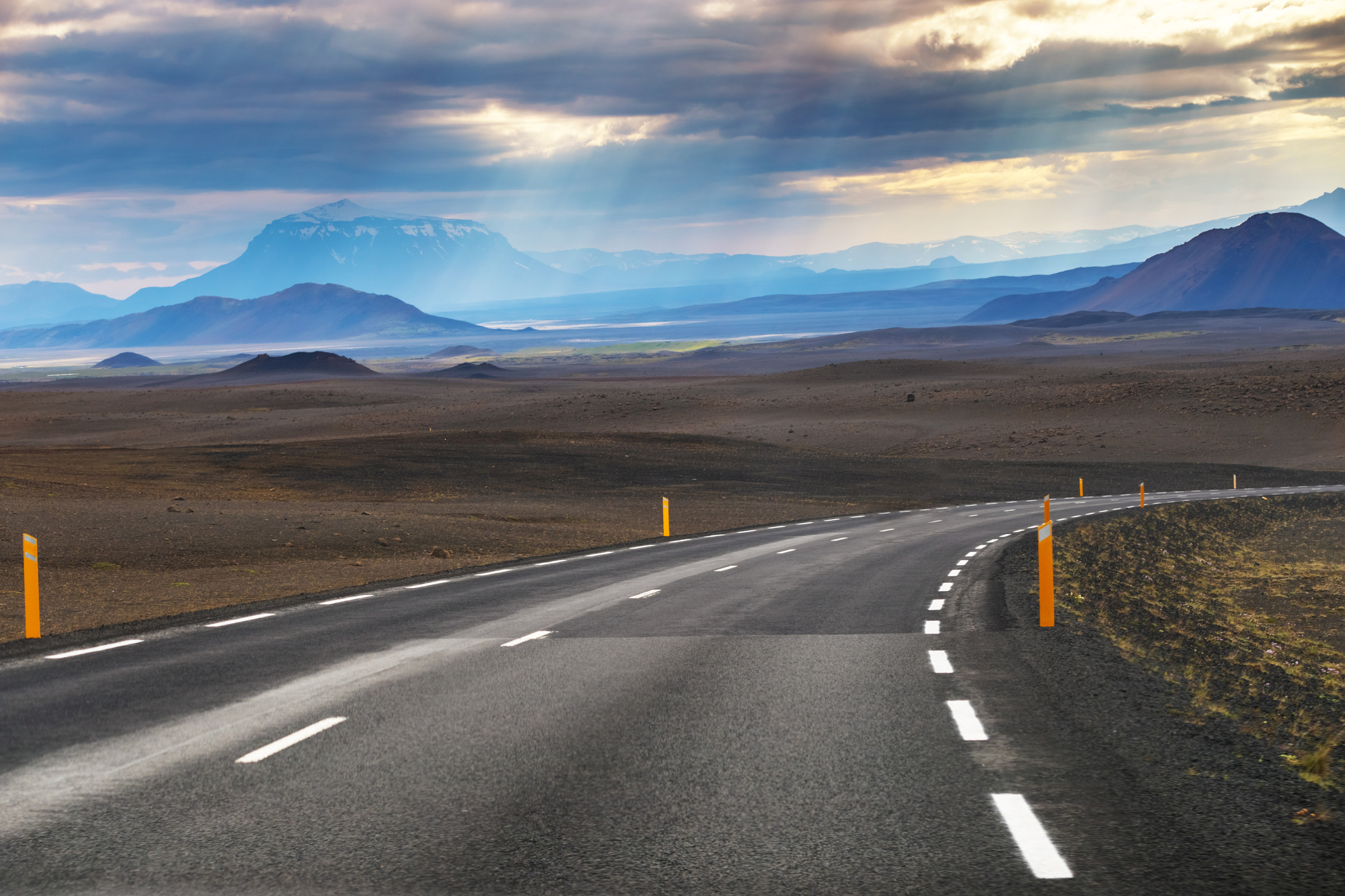 Picture of empty road with mountain Modrudalur and mountain Herdubreid as a background in Iceland, Summertime